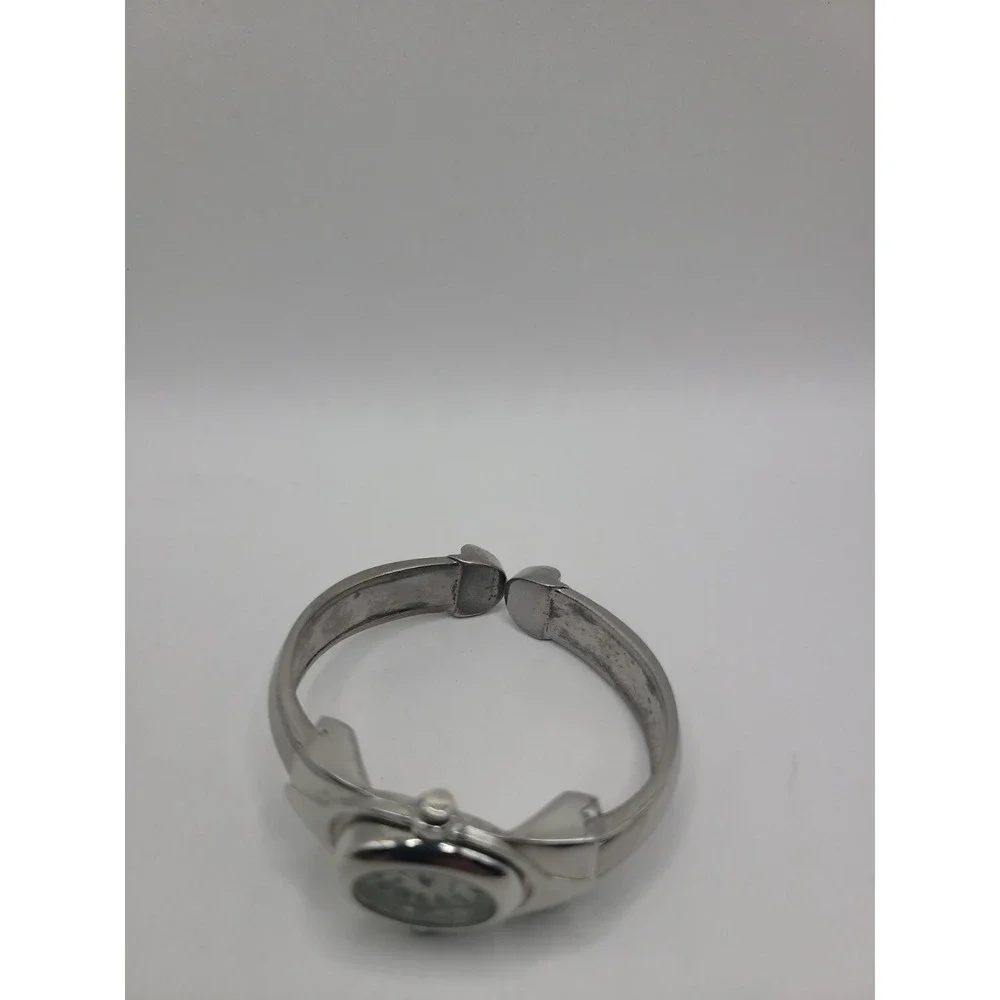 Xanadu Women's Silver Tone Hinged Cuff Bangle Quartz Watch Oval Dial Reverse